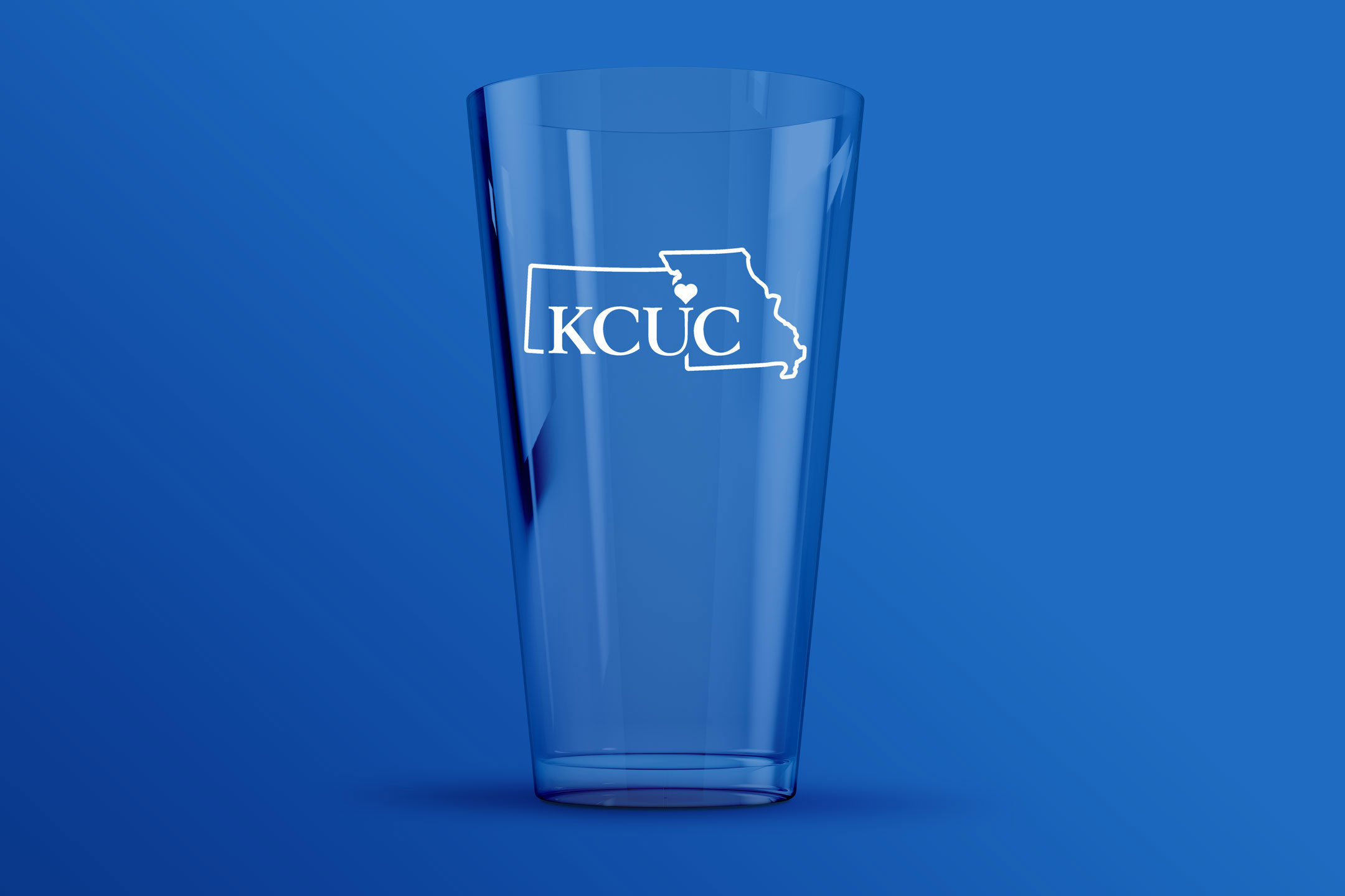 KCUC logo on a glass
