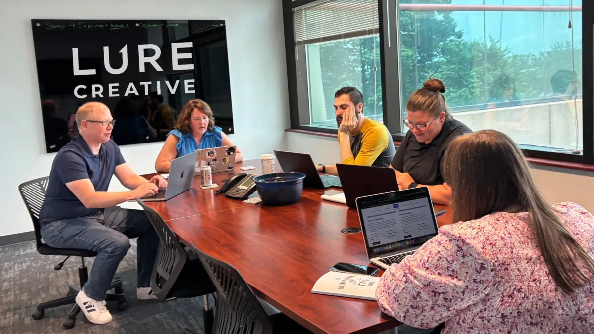 The Lure Creative digital marketing team during an internal meeting.